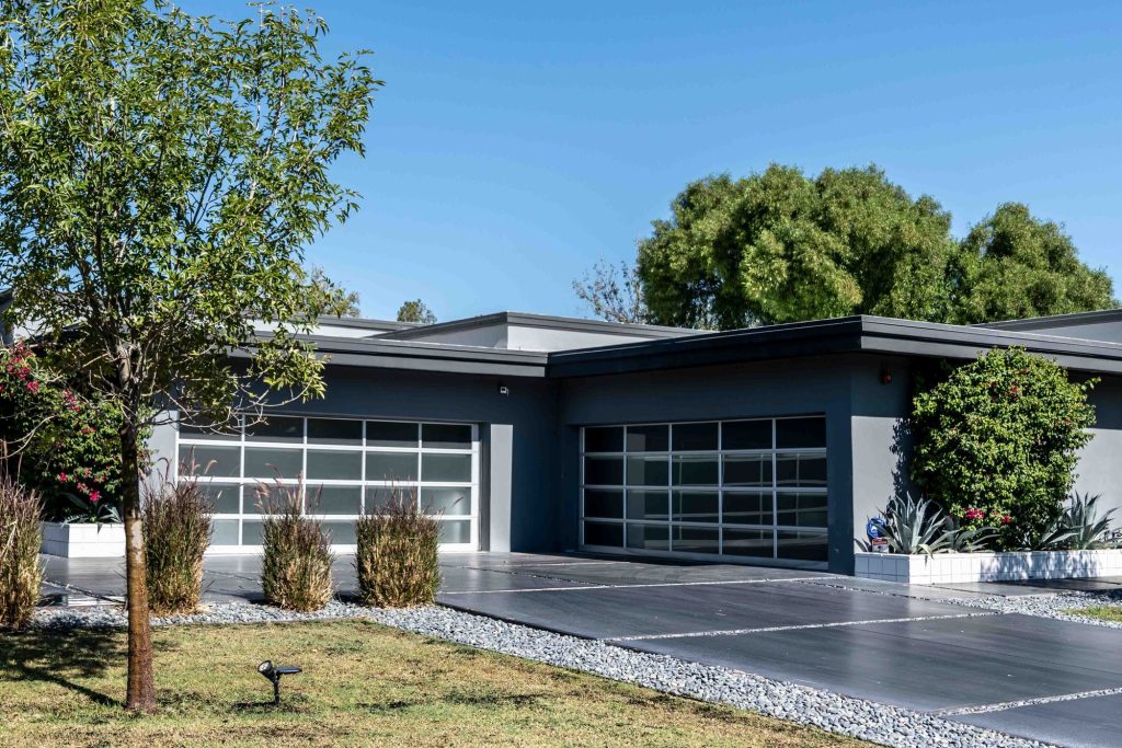 Modern full-view aluminum and glass garage doors from a Mission GDS job