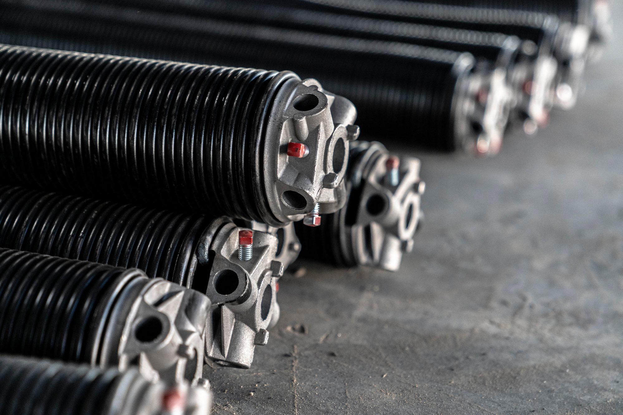 Garage door torsion springs ready for a Mission GDS repair job